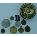 Coronation & other medallions in a WD & HO Wells tobacco tin