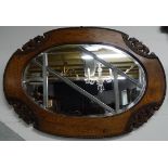 Carved oak framed mirror 33' across