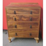 1920's period mahogany four drawer graduated chest with black metal filigree handles on pad feet