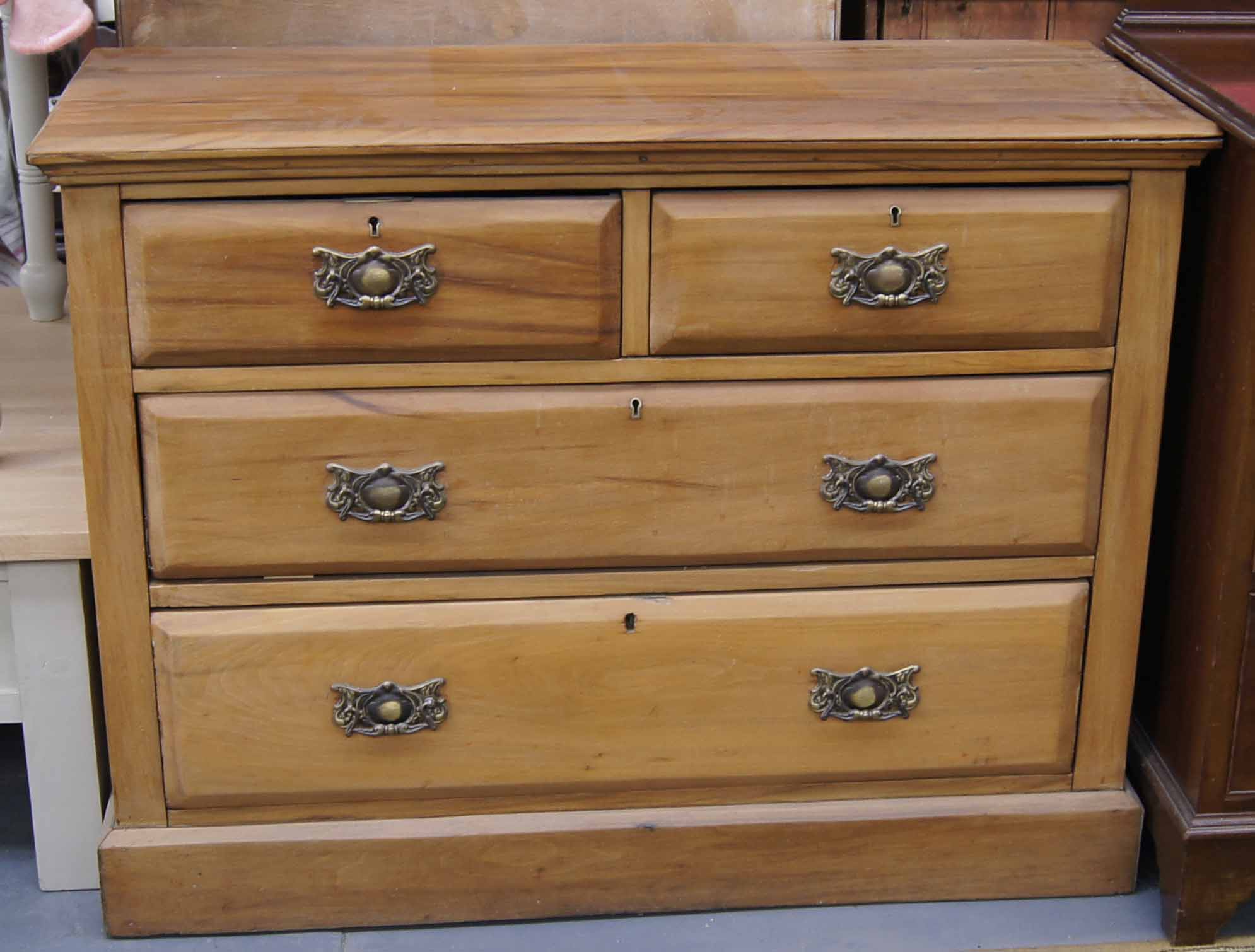 Late 19th early 20th c satinwood two over three chest of drawers with drop ring metal handles on