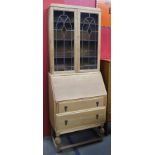 Original 1920's honeyoak bureau bookcase with leaded glass doors integral pigeon holes two drawers