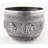 Late 19th c Indian silver bowl embossed with deity and warrior figures and leaf and scroll
