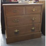 19th c oak two over two chest of drawers with brass drop ring handles on platform base 34ins H x