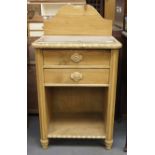 Late 19th C pine two drawer side cabinet with upstand protective glass top and platform storage