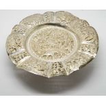 Early Eastern silver circular bonbon dish with decorative embossed animal and village scenes with