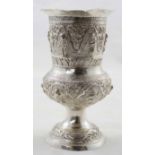 Early Eastern silver goblet with embossed figural deity and warrior relief and foliage scroll