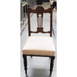 Set of four Victorian mahogany framed dining chairs with carved relief on turned legs re upholstered