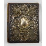 Late Victorian leather and silk bound desk folder/blotter with raised HM Silver decoration to