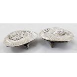 Two vintage silver bonbon dishes in the form of shells with decorative embossed foliage relief on