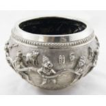 Late 19th early 20th c Burmese highly decorative silver bowl with raised deity and animal figure
