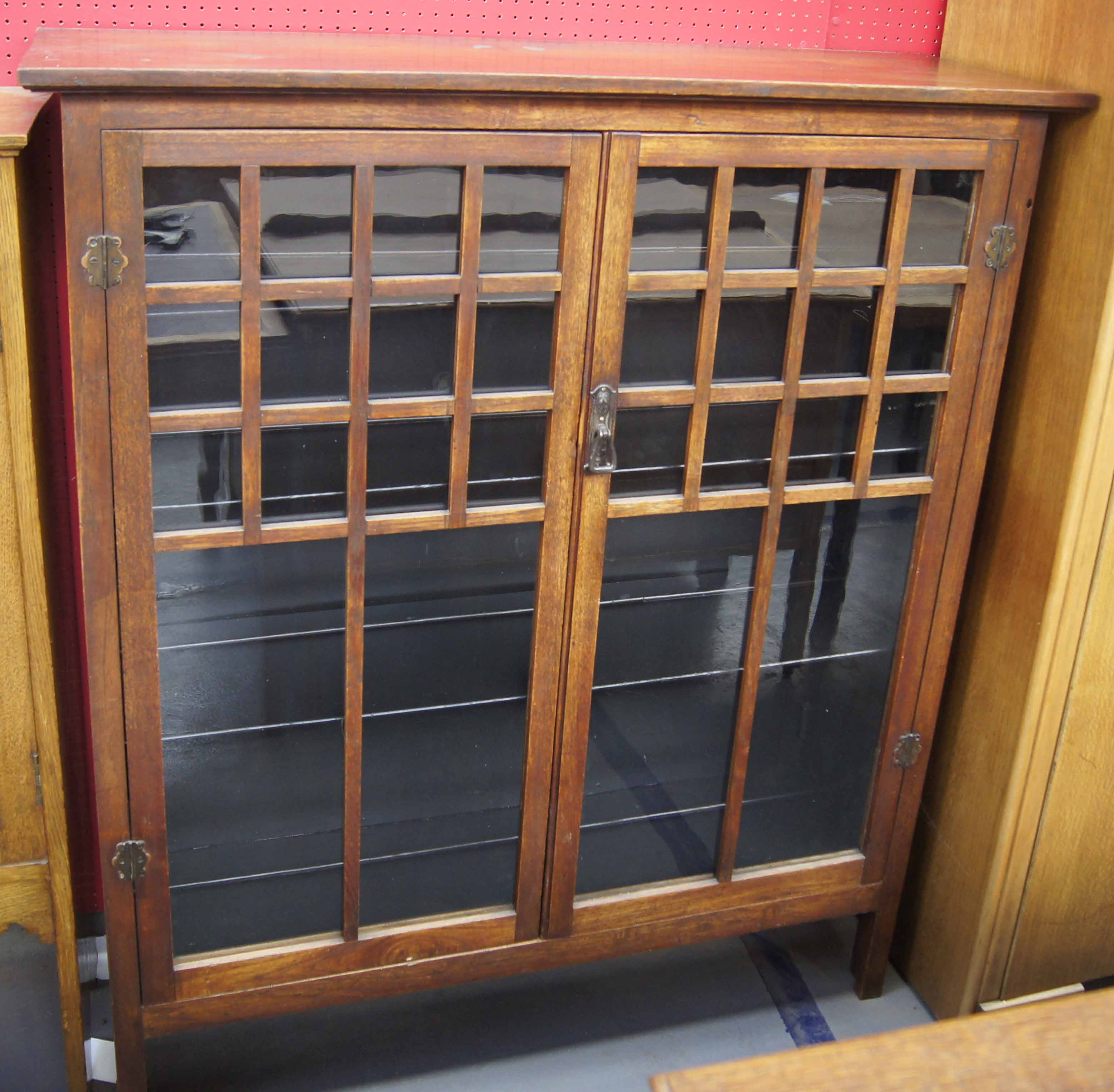 Late 19th early 20th c mahogany arts and crafts design book display cabinet with wood integral