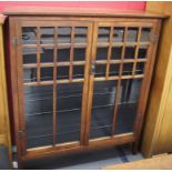 Late 19th early 20th c mahogany arts and crafts design book display cabinet with wood integral