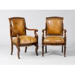 PAIR OF FAUTEUILS, Restoration, France ca. 1830. Mahogany, carved with stylised leaves and volutes