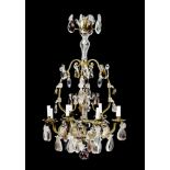 CHANDELIER, late Baroque, 19th century. Brass chandelier with glass drops and fruits, in part