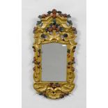 MIRROR, late Baroque, probably Germany. Wood, partly pierced and carved with flowers, rocailles