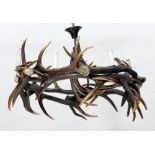 ANTLER CHANDELIER, in the rustic style. Round, open-worked body made of deer antlers with 6 light