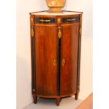 CORNER CABINET, 2nd Empire, France, 19th century. Mahogany with rectangular, ebonized reserves.