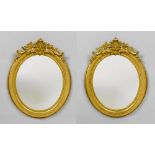 PAIR OF MIRRORS, Louis Philippe, France. Wood and stucco, gilt. Oval frame with pierced top