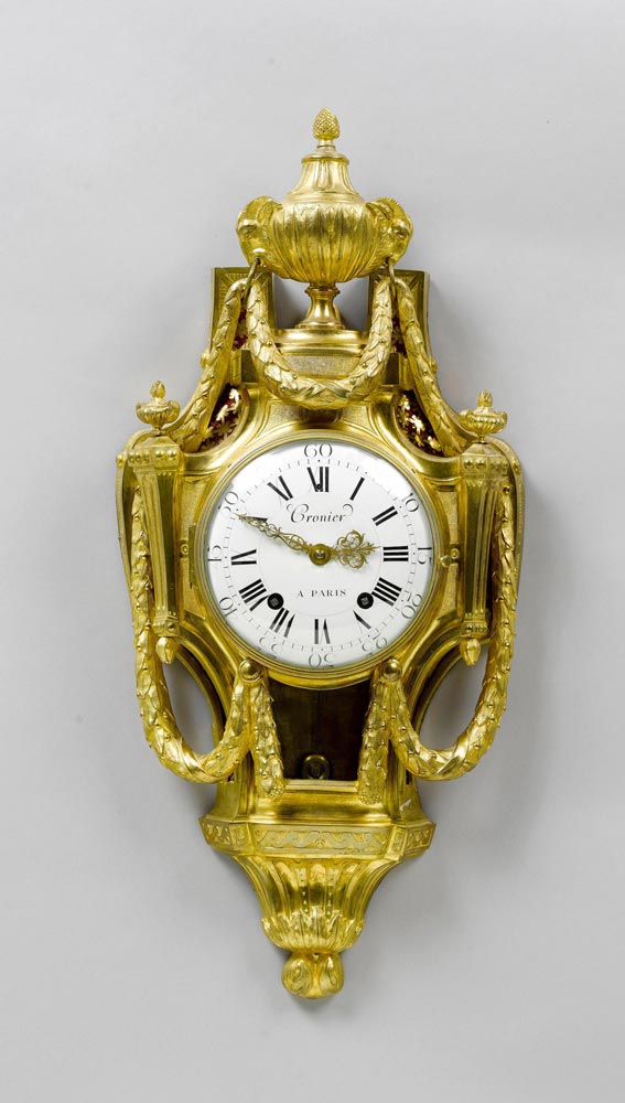 CARTEL CLOCK, Louis XVI, Paris, the dial signed CRONIER À PARIS Gilt bronze. Designed as a cartouche