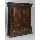 ARMOIRE, Baroque, Basel, 18th century. Walnut, stained and carved with an angel's head, a mascaron