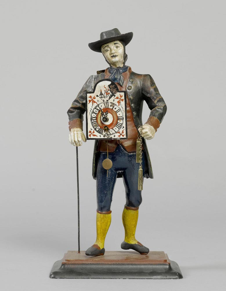 FIGURE CLOCK, Black Forest. Cast iron, painted. Movement with spring winding. H 38 cm.