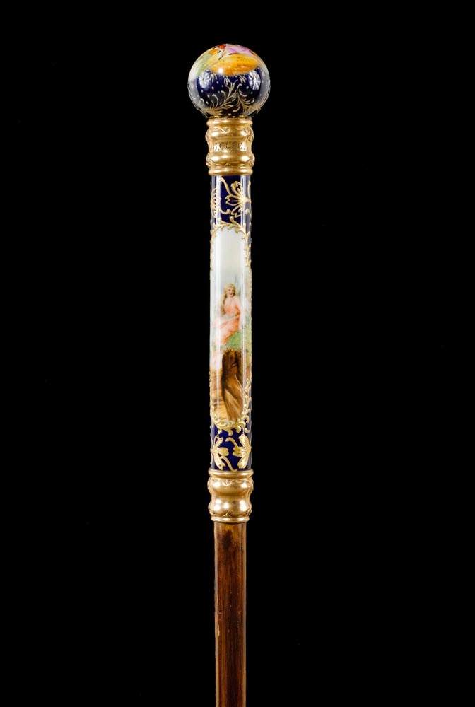 LADY'S WALKING STICK,English, 19th century. Inscribed 'J. C. LEE'. Porcelain sphere as a grip,