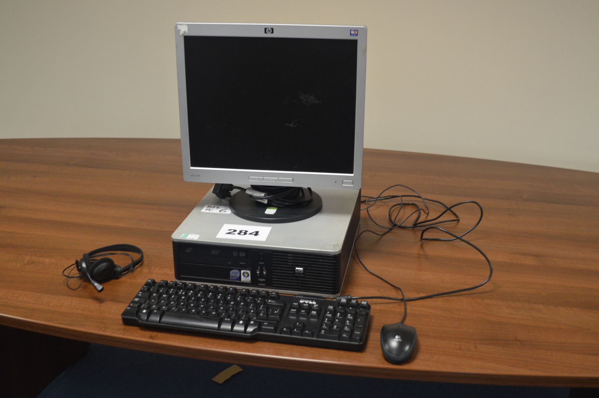 Hp Compaq DC7900 Intel Core 2 Duo personal computer with keyboard, monitor, mouse, headphones.