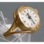 Ringuhr
18 kt. Rotgold, Marke "Kasper", Handaufzug, cremefarbenes Zifferblatt, 
 gebläute