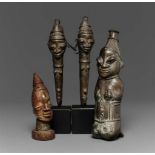 FOUR YORUBA ARTEFACTS  A pair of Ogboni brass staves with head finials; an Ogboni kneeling brass
