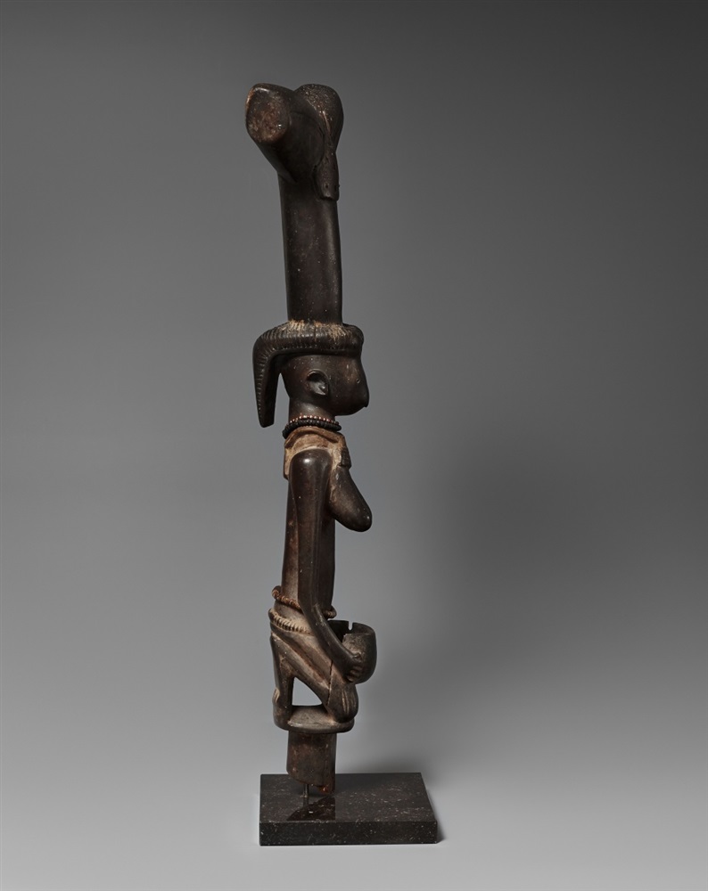 A YORUBA STAFF FOR SHANGO  Oshe Shango, carved as a kneeling female figure of elongated form holding - Image 2 of 4