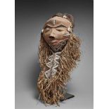 A PENDE MASK  The beard with carved and painted geometric ornament and with attached raffia, woven