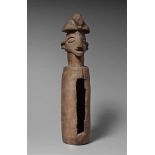 A YAKA SLIT DRUM  Mukoko ngombo, the head finial with conical headdress; and a box of associated
