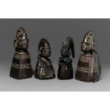 FOUR YORUBA CULT FIGURES  Each with tapered rectangular body and head finial, median ridged coiffure