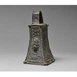 A BENIN BRONZE BELL Of quadrangular form, the sides with incised scrolling ornament within hatched