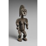 AN IGALA FIGURE The standing female with tall median-crested coiffure falling down the nape of the