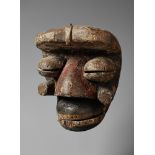 A GUERE/WE MASK With large bulbous nose, the prominent eyes with pierced slits, articulated lower