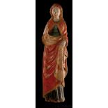 Carved wooden polychrome and gilt sculpture.  Flemish.  Late 14th century.   The saint is depicted