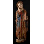 "Saint John". Carved wooden polychrome sculpture with predominately red and blue tones.  Romanesque.