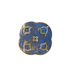 Ornamental quatrefoil plaque made of gilded copper, decorated with ultramarine, sky blue, yellow,