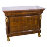 Mahogany and gilt carved chest of drawers.  Empire period.  From around 1800. With a red marble