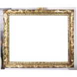 Large carved and gilded wooden frame.  17th century.   Frame exterior measurements: 145 x 120 cm.