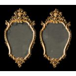 A pair of carved and gilded wood mirrors. France. Early 18th Century. Size: 91 x 46 cm.