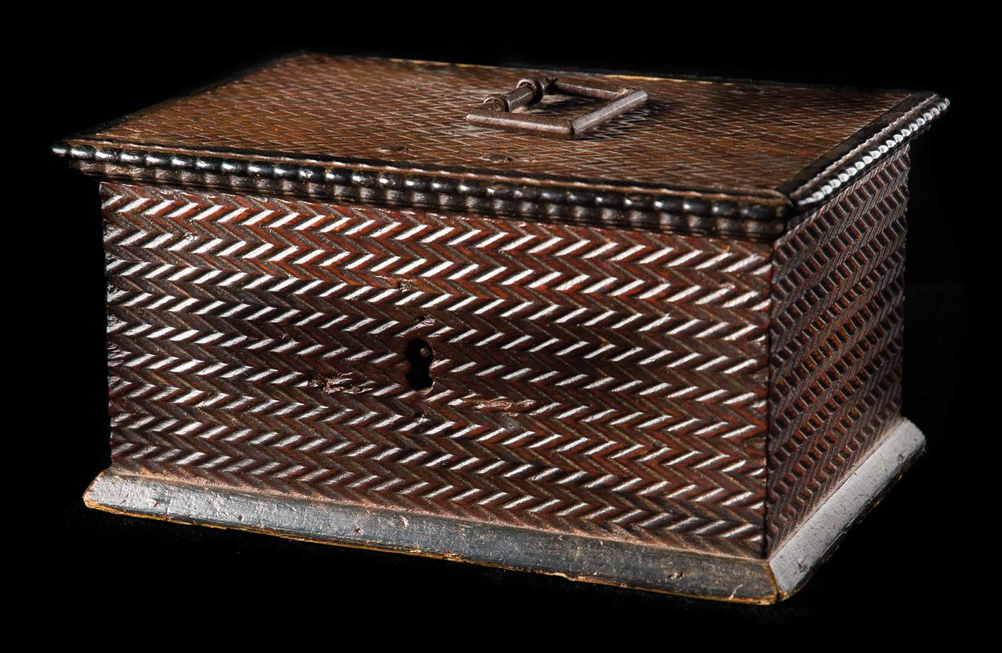 Walnut wood box with ironwork. 17th century.   Carved curvy zigzag decoration.  Attractive gilded