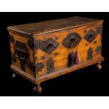 A spanish carved wood and ironwork three keys safe-box. 16th century Size: 46 x 75 x 38 cm.