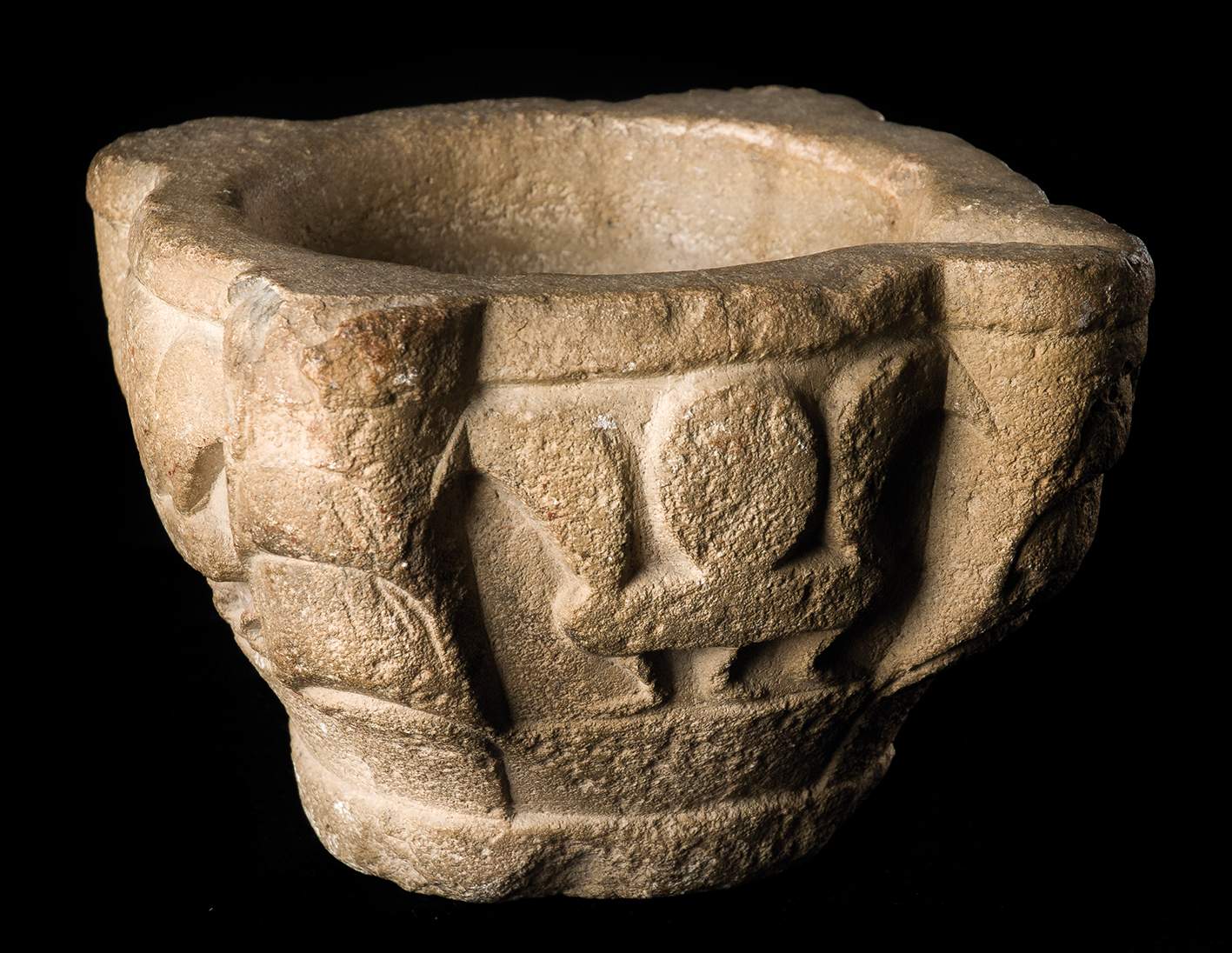 Stone mortar. Asturias. Pre-Romanesque. 9th century. Height: 16.5 cm.