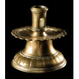 Bronze candlestick. 14th century Decorated with floral incisions and with a fluted base.  Height: