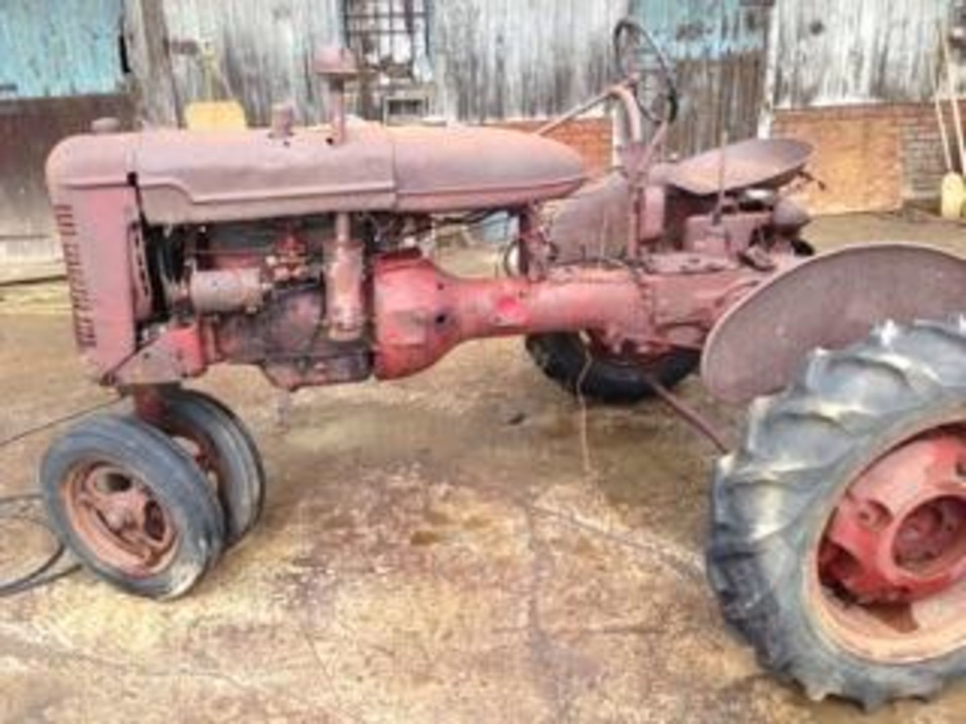 Farmall B with parts removed, would make a great restoration project!  This tractor was in a shed