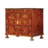 A WILLIAM AND MARY OYSTER VENEERED WALNUT DWARF CHEST A WILLIAM AND MARY OYSTER VENEERED WALNUT