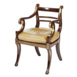 A REGENCY PERIOD BEECHWOOD ELBOW CHAIR, PAINTED WITH SIMULATED ROSEWOOD... A REGENCY PERIOD