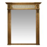 A REGENCY OVERMANTEL MIRROR, CIRCA 1820 The upper panel painted with... A REGENCY OVERMANTEL MIRROR,